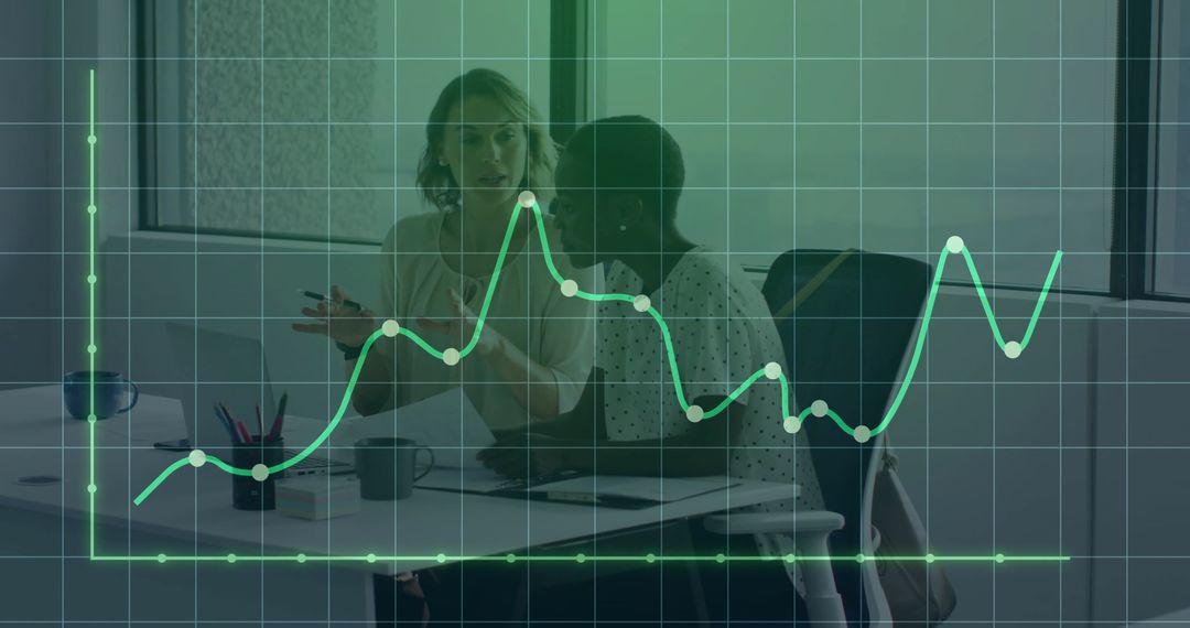 Colleagues Discussing Financial Data in Office Setting