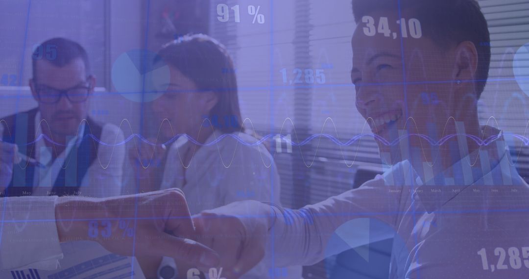 Innovative Team Analyzing Financial Graphs and Data Charts for Success