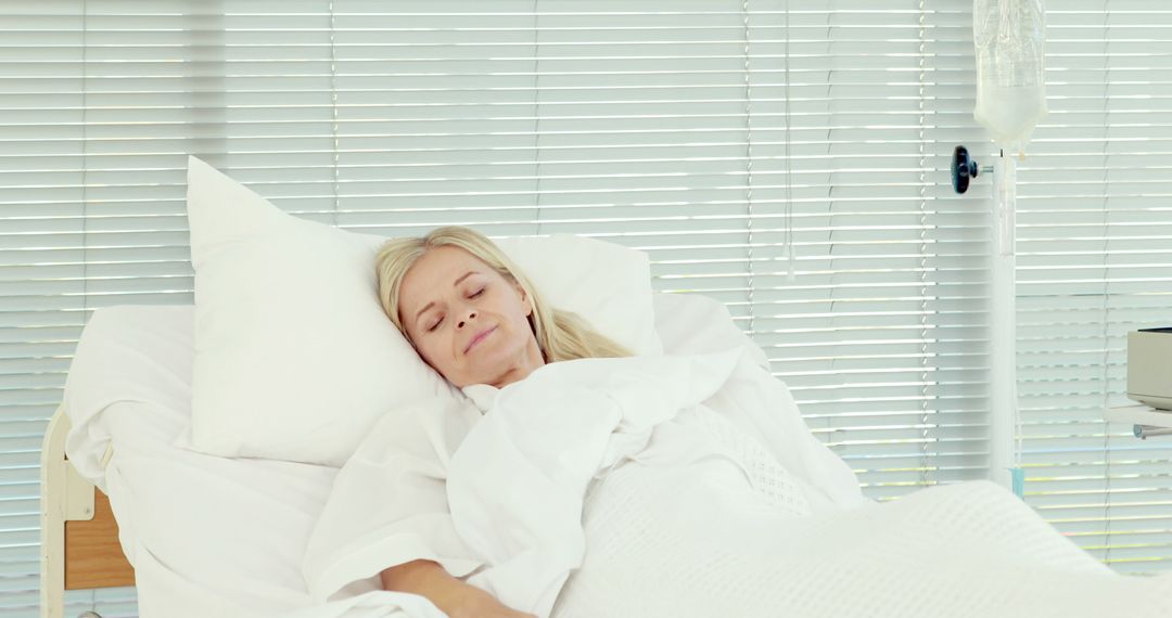 Senior Woman Resting in Hospital Bed with Closed Blinds - Free Images, Stock Photos and Pictures on Pikwizard.com