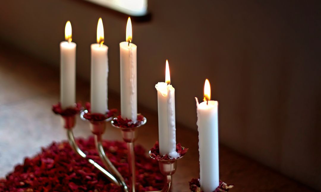 Elegant Candles Burning in Holder with Rose Petals - Free Images, Stock Photos and Pictures on Pikwizard.com