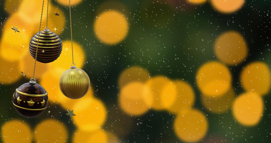 Black and Gold Christmas Baubles with Falling Snow and Orange Lights - Free Images, Stock Photos and Pictures on Pikwizard.com