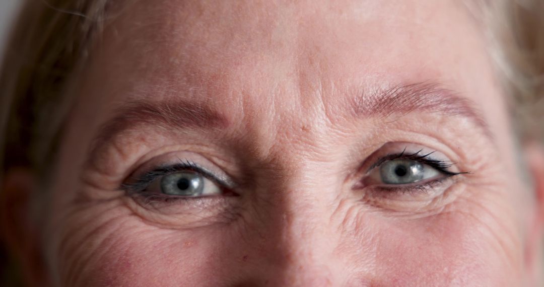Close-up of Senior Woman's Eyes with Crow's Feet and Elegantly Applied Eyeliner