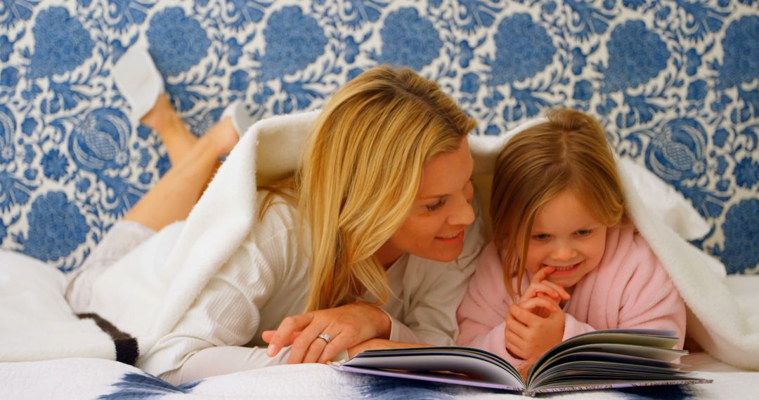 Mother and Daughter Reading Bedtime Story Together in Cozy Bedroom - Free Images, Stock Photos and Pictures on Pikwizard.com