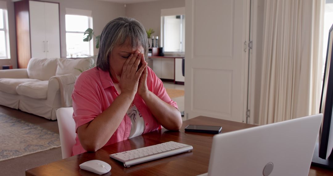 Frustrated Senior Woman Using Computer At Home