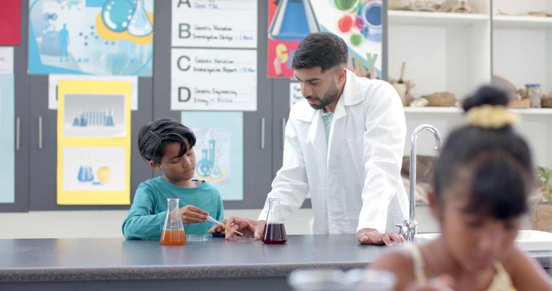 Teacher Assisting Student with Science Experiment in Classroom