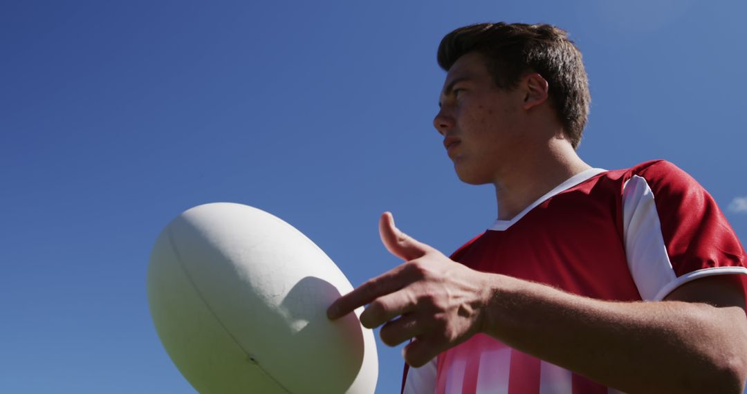 Rugby Player Preparing to Shoot Ball on Field - Free Images, Stock Photos and Pictures on Pikwizard.com