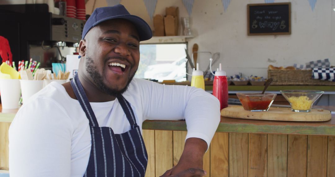 Smiling Chef at Food Truck with Product Display