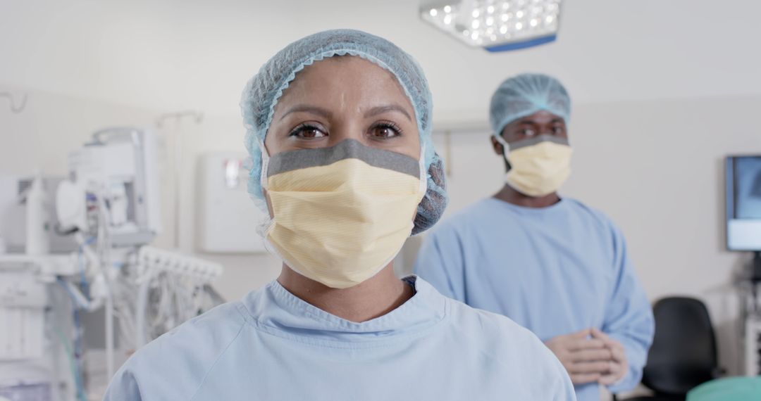 Medical Professionals in Surgical Attire Prepping for Surgery in Modern Operating Room - Free Images, Stock Photos and Pictures on Pikwizard.com