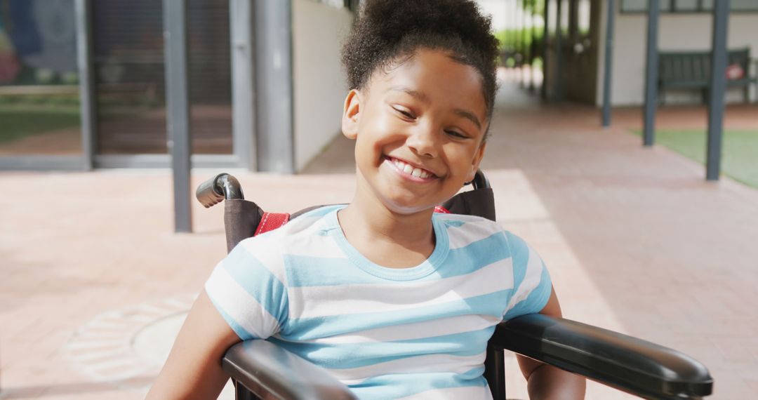 Smiling Biracial Girl in Wheelchair at School - Free Images, Stock Photos and Pictures on Pikwizard.com