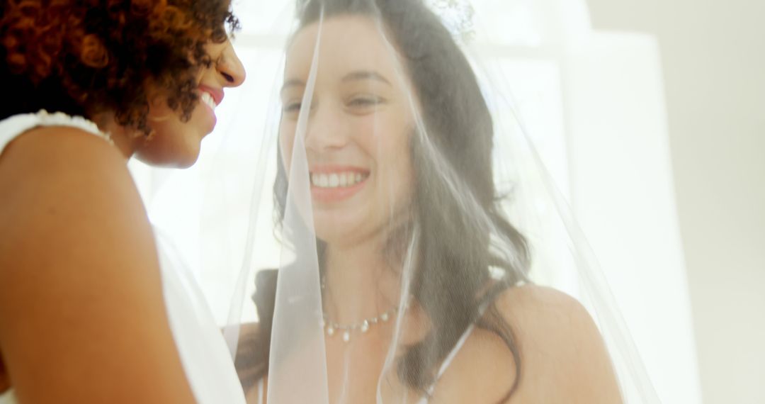 Joyful Bride with Bridesmaid Sharing Wedding Day Smiles - Free Images, Stock Photos and Pictures on Pikwizard.com