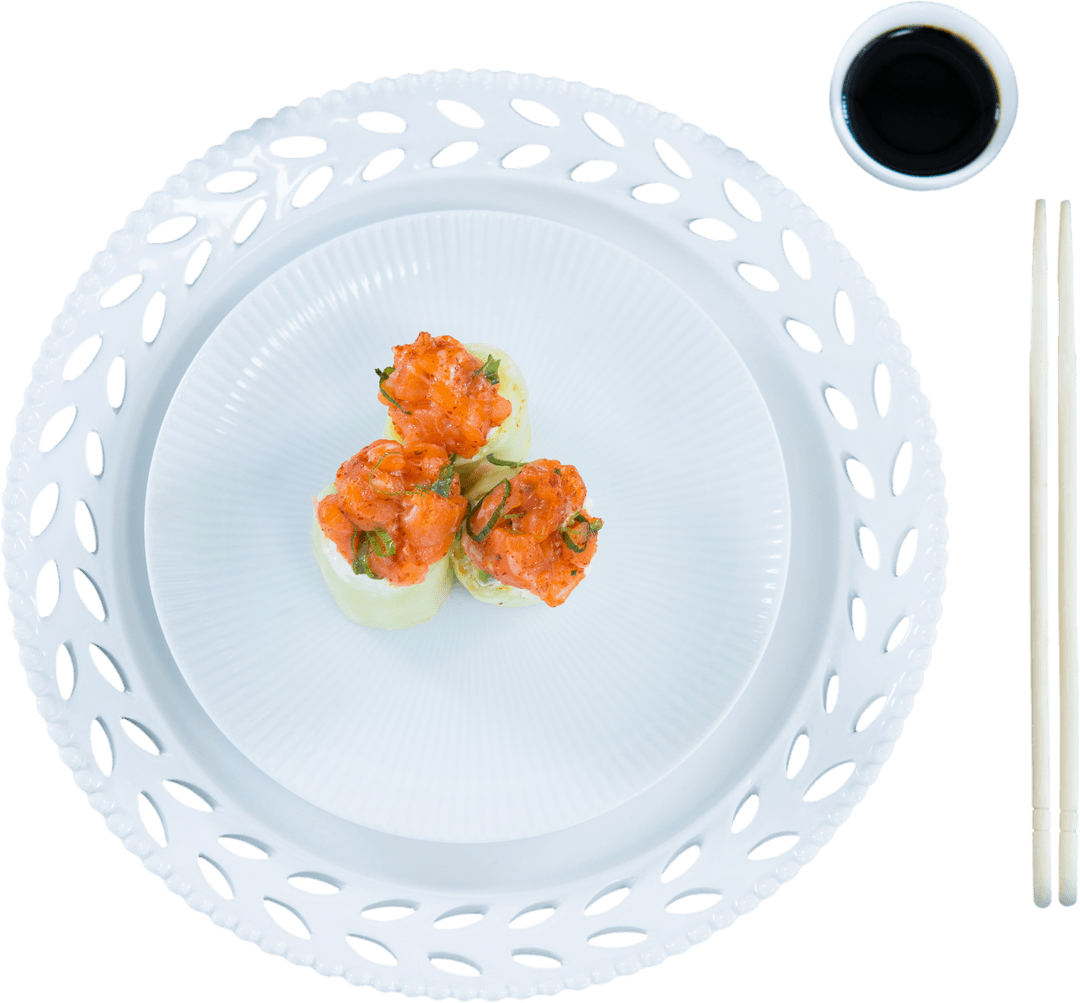 Gourmet Sushi on Elegant Ceramic Platter with Transparent Soy Dish