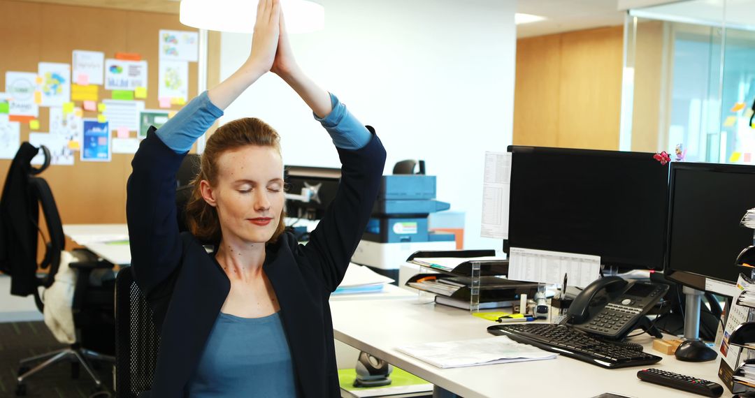 Young Businesswoman Meditating at Desk in Modern Office - Free Images, Stock Photos and Pictures on Pikwizard.com