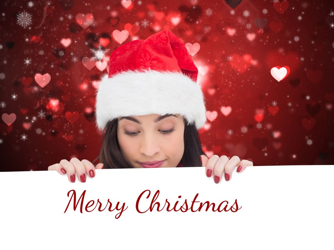 Woman Wearing Santa Hat Holding Merry Christmas Sign - Download Free Stock Templates Pikwizard.com