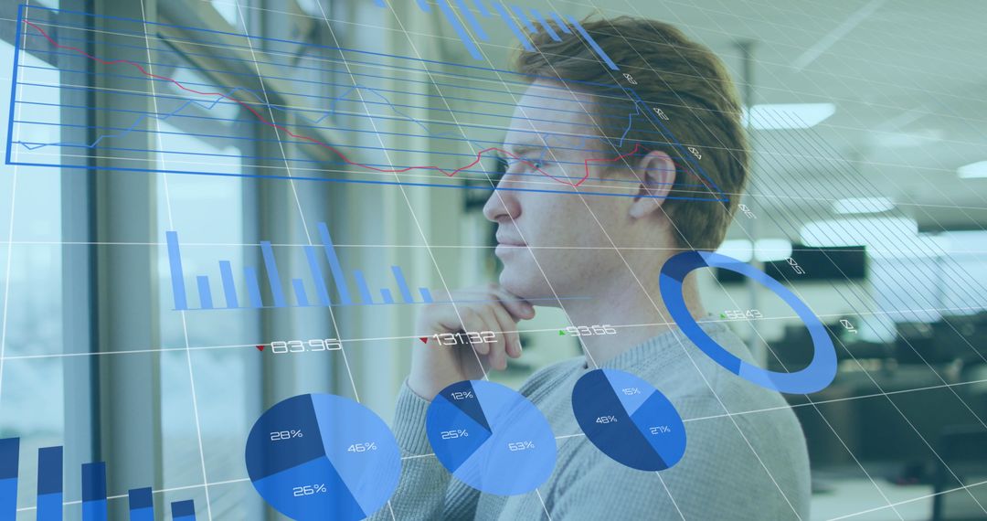 Thoughtful Businessman Analyzing Graphs in Modern Office