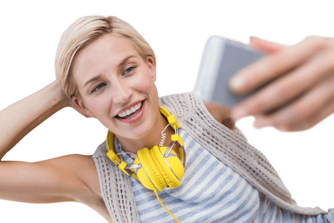 Smiling Woman with Headphones Taking Transparent Selfie