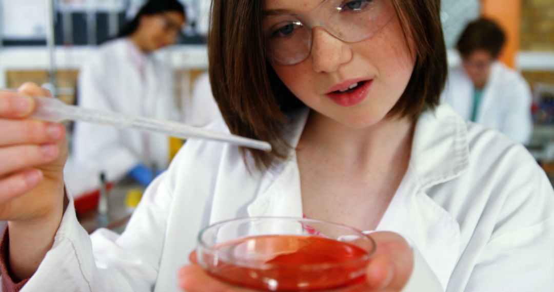 Young Scientist Conducting Experiment with Petri Dish and Pipette - Free Images, Stock Photos and Pictures on Pikwizard.com