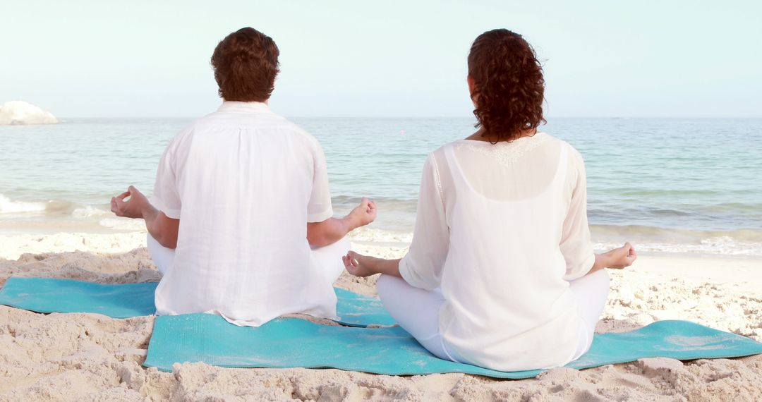 Couple Practicing Mindfulness Meditation on Tranquil Beach - Free Images, Stock Photos and Pictures on Pikwizard.com