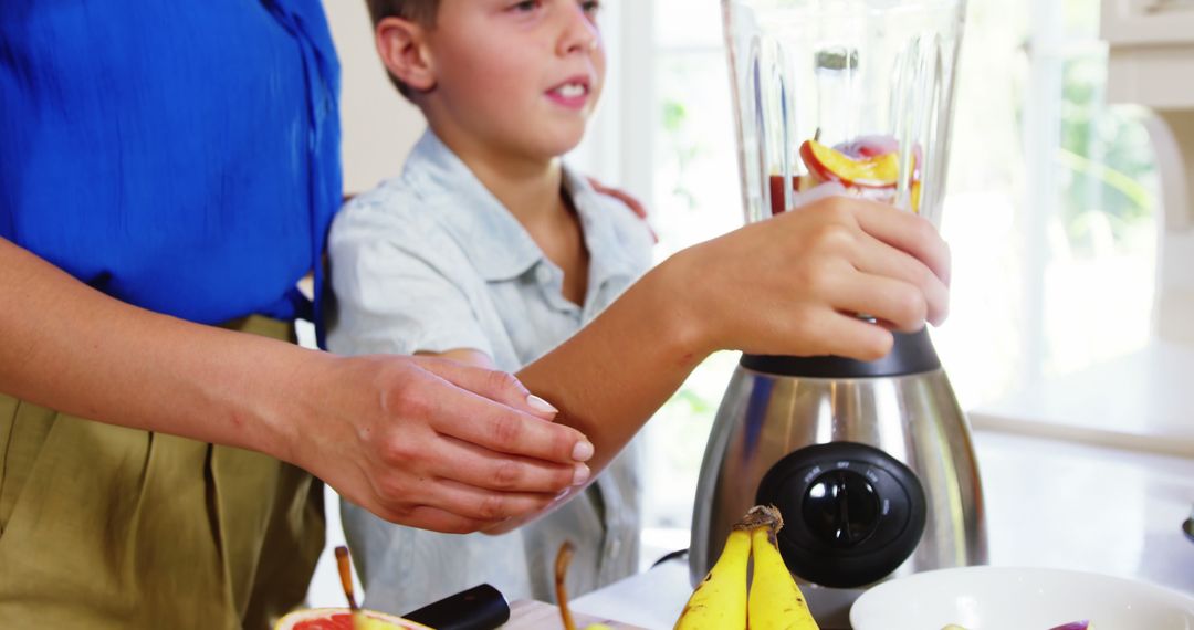 Child Helping Parent Make Healthy Smoothie with Blender - Free Images, Stock Photos and Pictures on Pikwizard.com