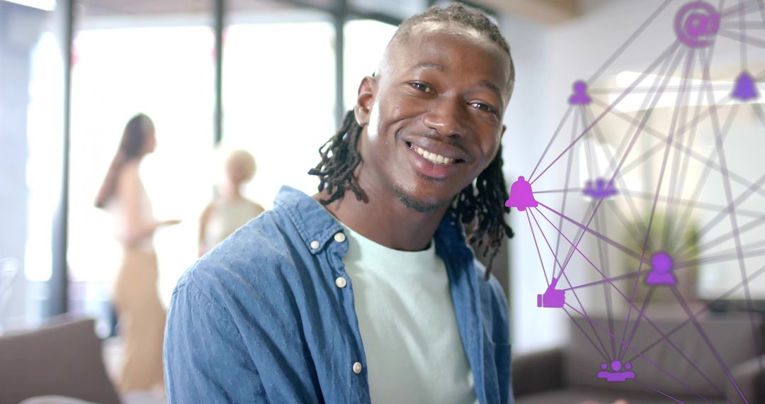 Smiling man with braids in modern coworking lounge with purple social network overlay
