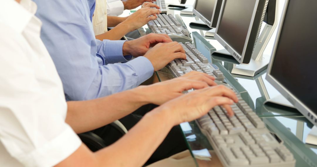 People Typing on Keyboards in Row at Workplace - Free Images, Stock Photos and Pictures on Pikwizard.com