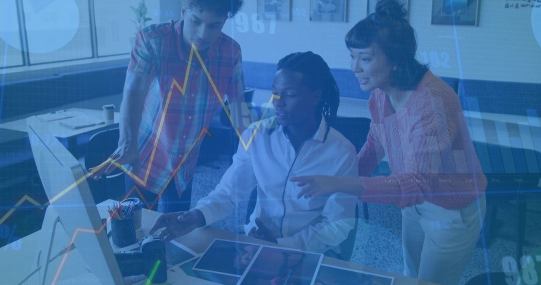 Diverse Team Analyzing Design Mockups in Modern Workspace