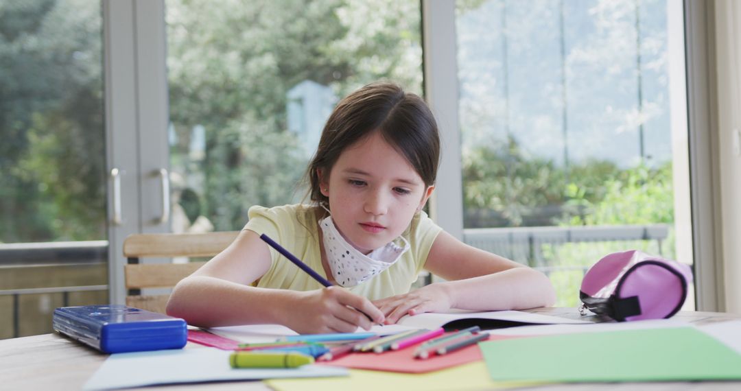 Young Girl Doing Homework During Lockdown at Home