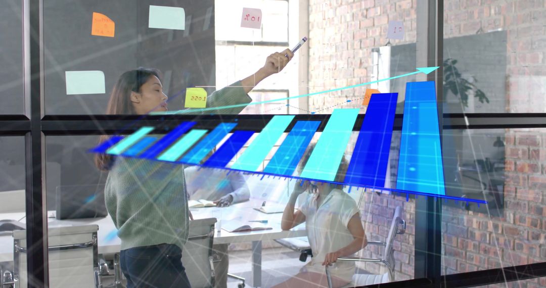 Diverse Team Collaborating on Digital Data Analytics in Modern Office