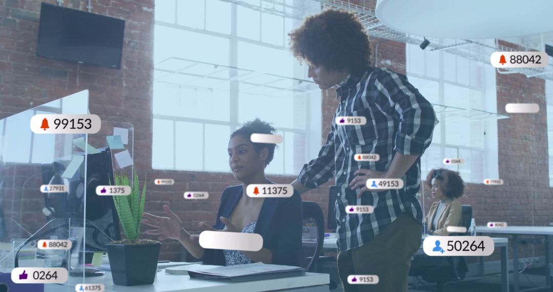 Diverse Team Analyzing Digital Notifications in Modern Office