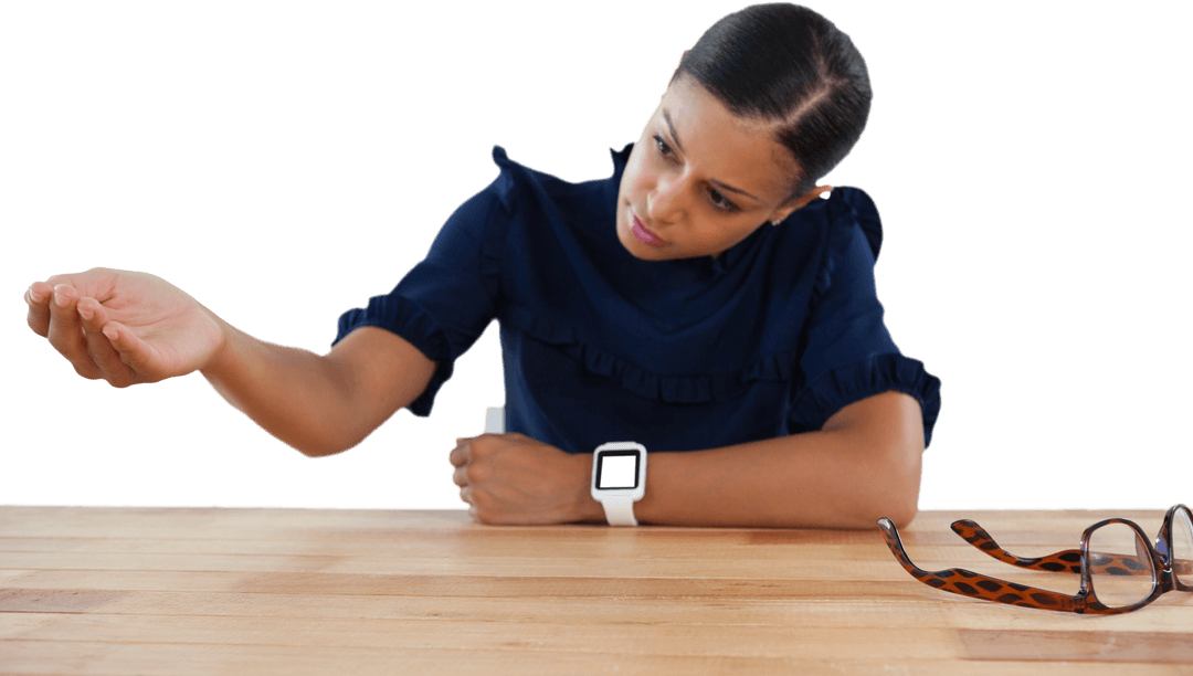 Businesswoman Engaging with Transparent Virtual Interface on Desk