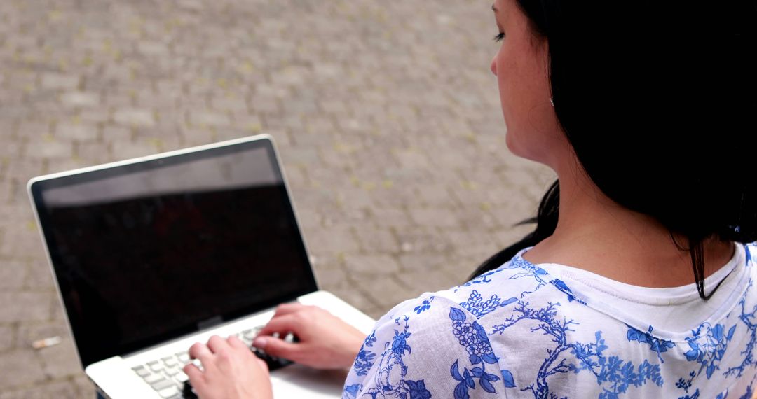 Woman Typing on Laptop Outdoors - Free Images, Stock Photos and Pictures on Pikwizard.com