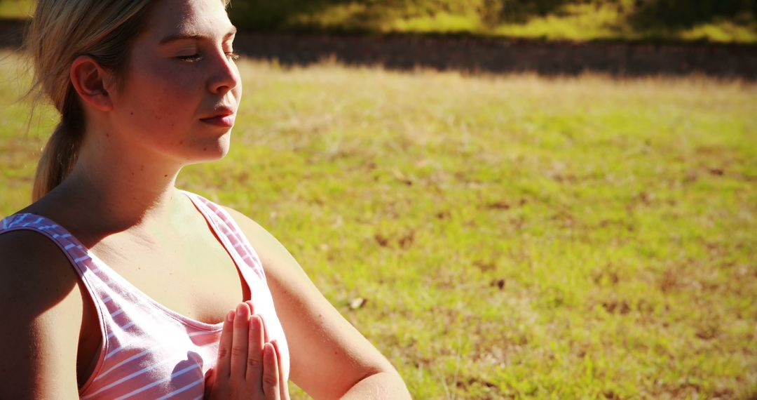 Serene Woman Practicing Yoga Outdoors at Sunset - Free Images, Stock Photos and Pictures on Pikwizard.com