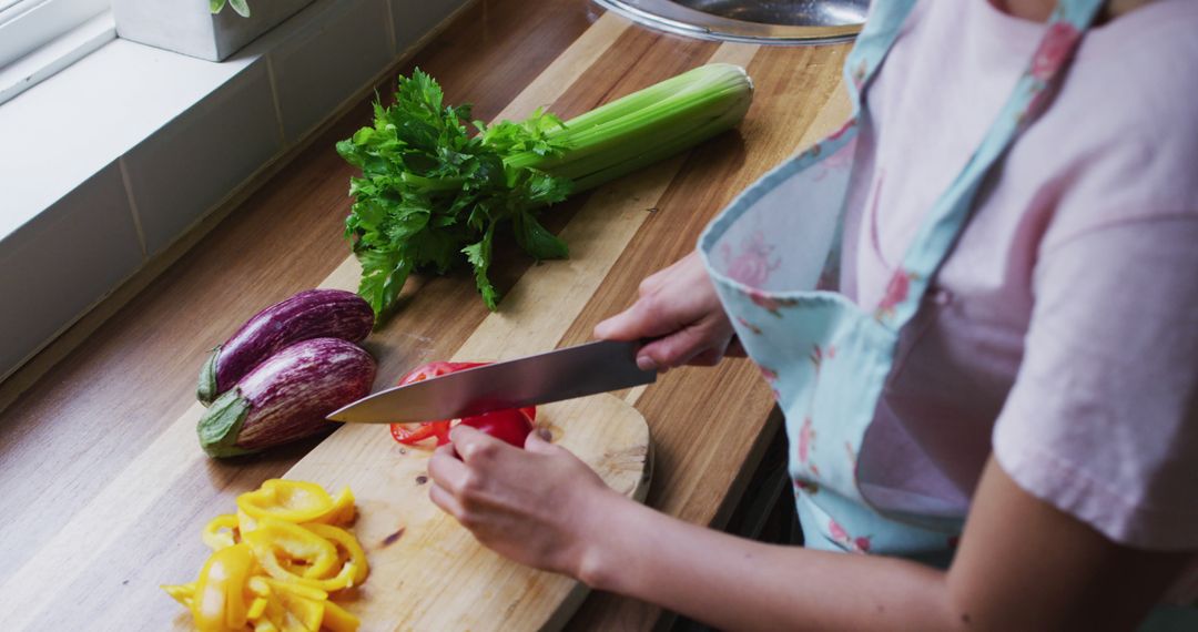 Woman Preparing Vegetables in Kitchen - Free Images, Stock Photos and Pictures on Pikwizard.com