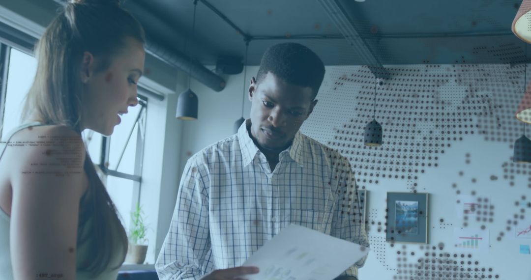 Diverse Team Discussing Global Business Strategy in Modern Office