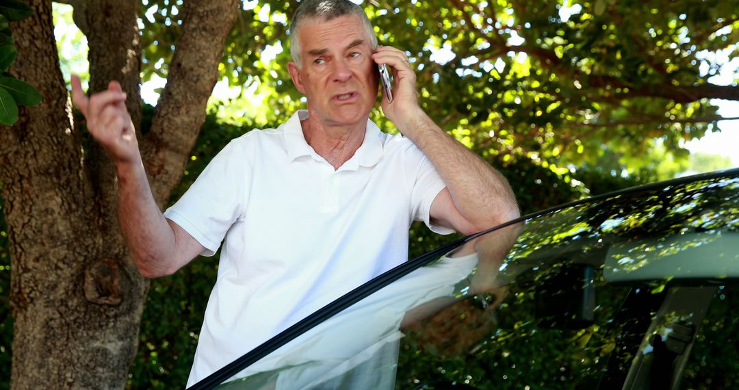 Older Man Having Serious Phone Conversation Outdoors Near Car - Free Images, Stock Photos and Pictures on Pikwizard.com