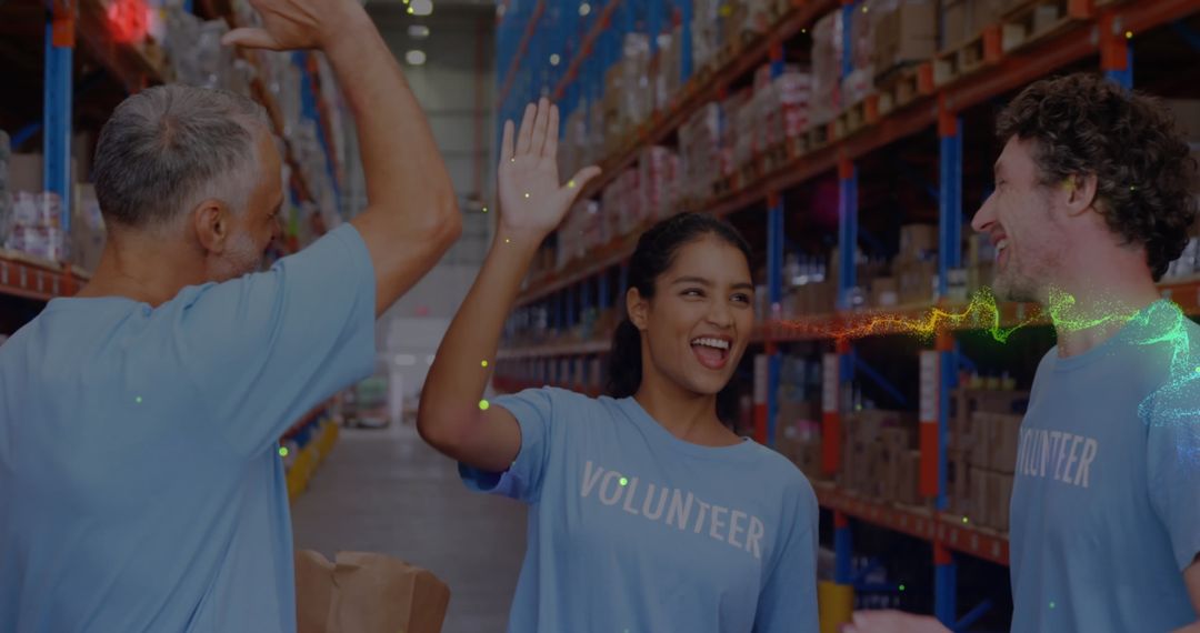 Volunteers Celebrating Teamwork in Warehouse