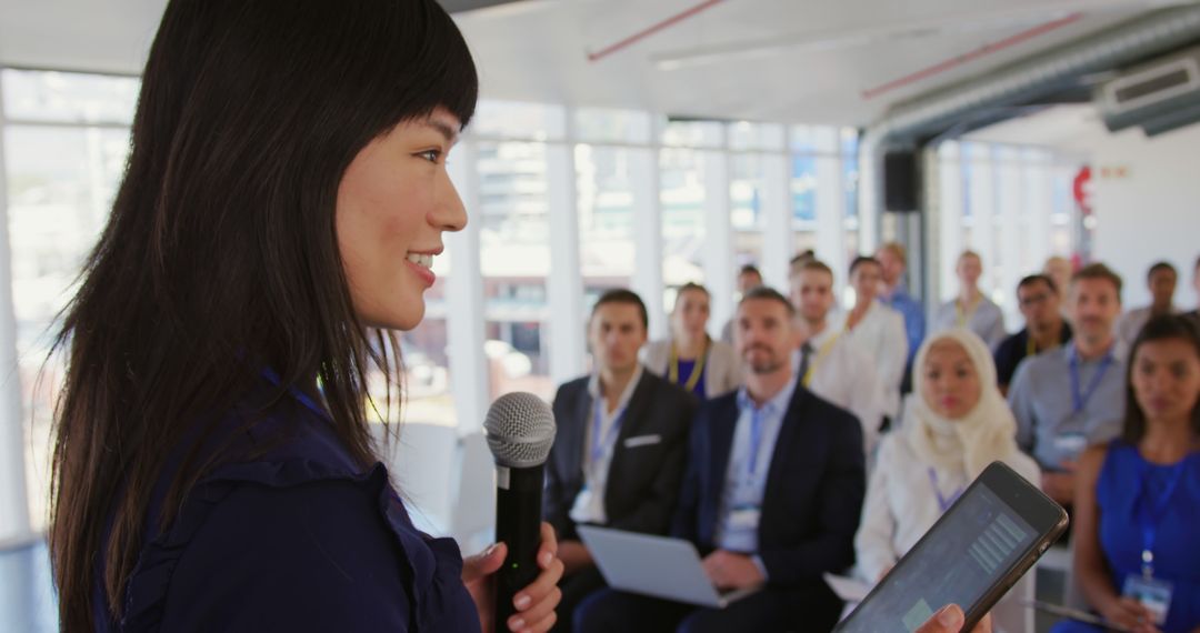 Businesswoman Giving Presentation to Diverse Audience in Modern Office - Free Images, Stock Photos and Pictures on Pikwizard.com