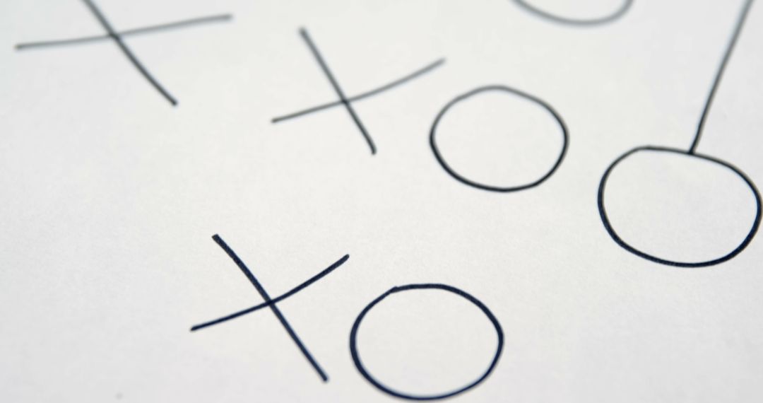 Close-up of Tic-Tac-Toe Game on White Paper - Free Images, Stock Photos and Pictures on Pikwizard.com