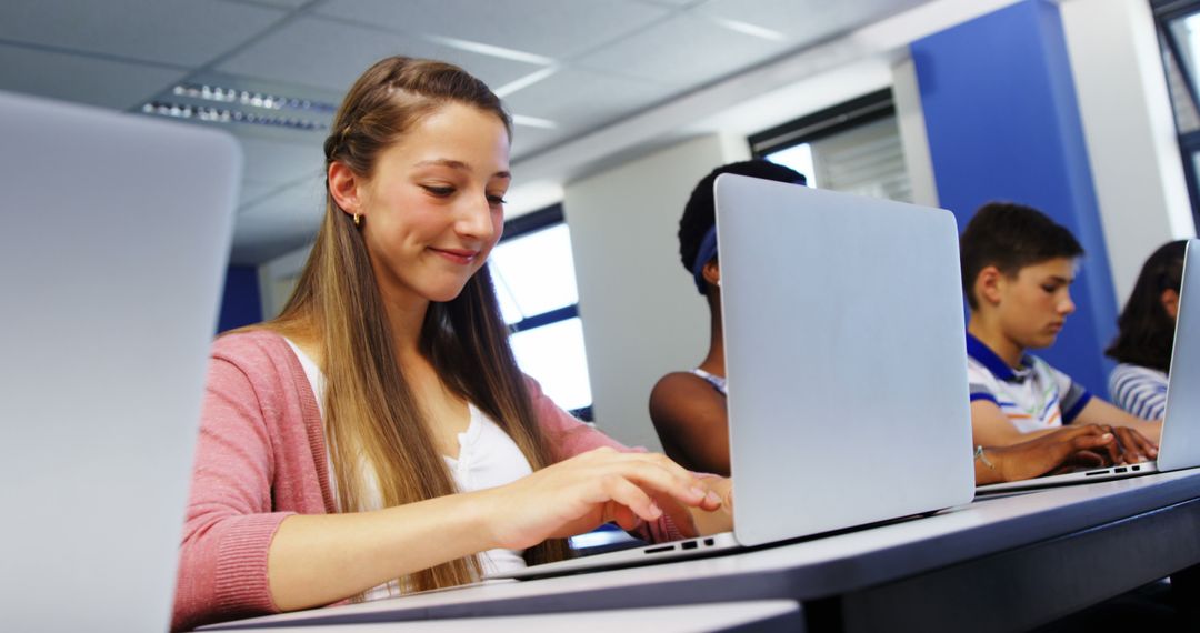 Teenage Students Studying on Laptops in Classroom - Free Images, Stock Photos and Pictures on Pikwizard.com