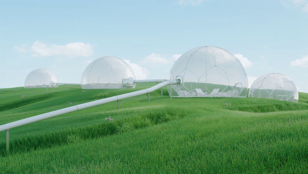 Transparent geodesic domes connected by elevated tubular walkway on rolling green meadow