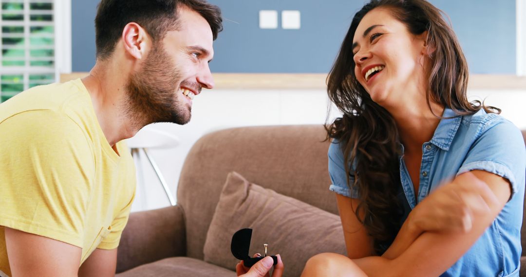 Man Proposing to Happy Woman at Home - Free Images, Stock Photos and Pictures on Pikwizard.com