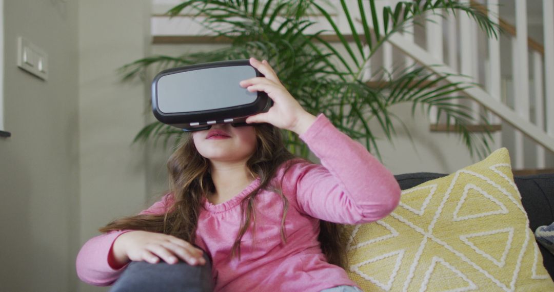 Young Girl Using Virtual Reality Headset at Home for Fun and Discovery