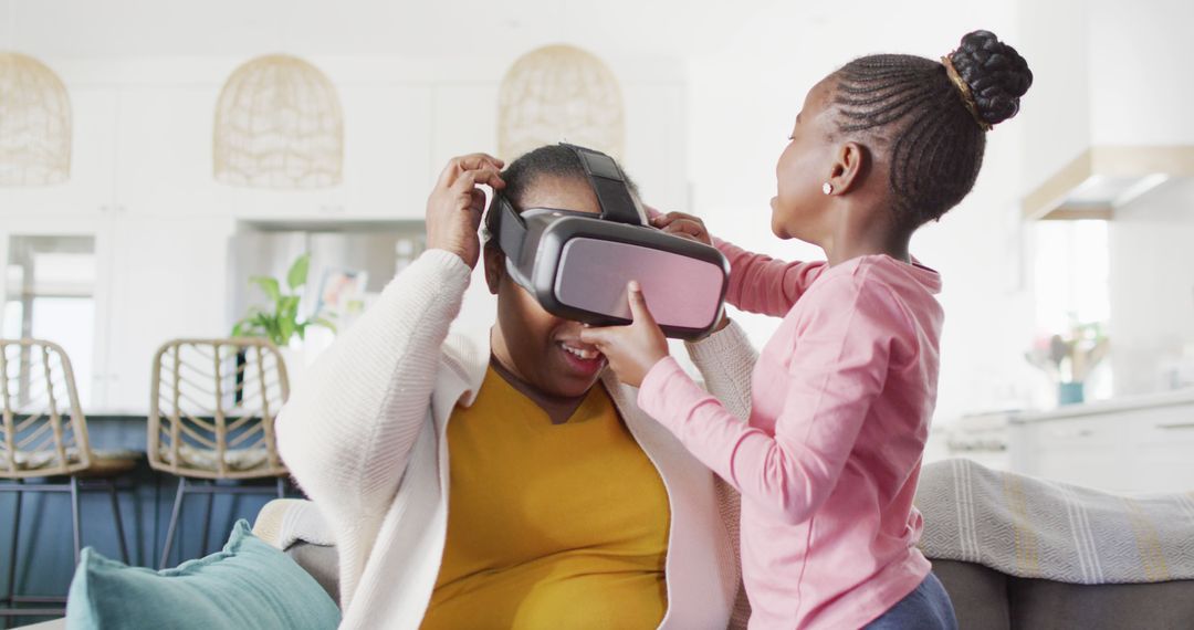 Mother and Daughter Enjoying VR Gaming Experience at Home - Free Images, Stock Photos and Pictures on Pikwizard.com