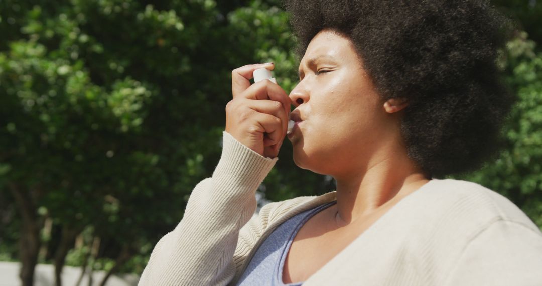 Woman Using Inhaler Outdoors in Natural Setting - Free Images, Stock Photos and Pictures on Pikwizard.com