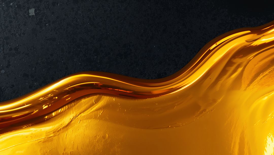 Flowing Glossy Amber Wave of Viscous Liquid with Reflective Gold Texture