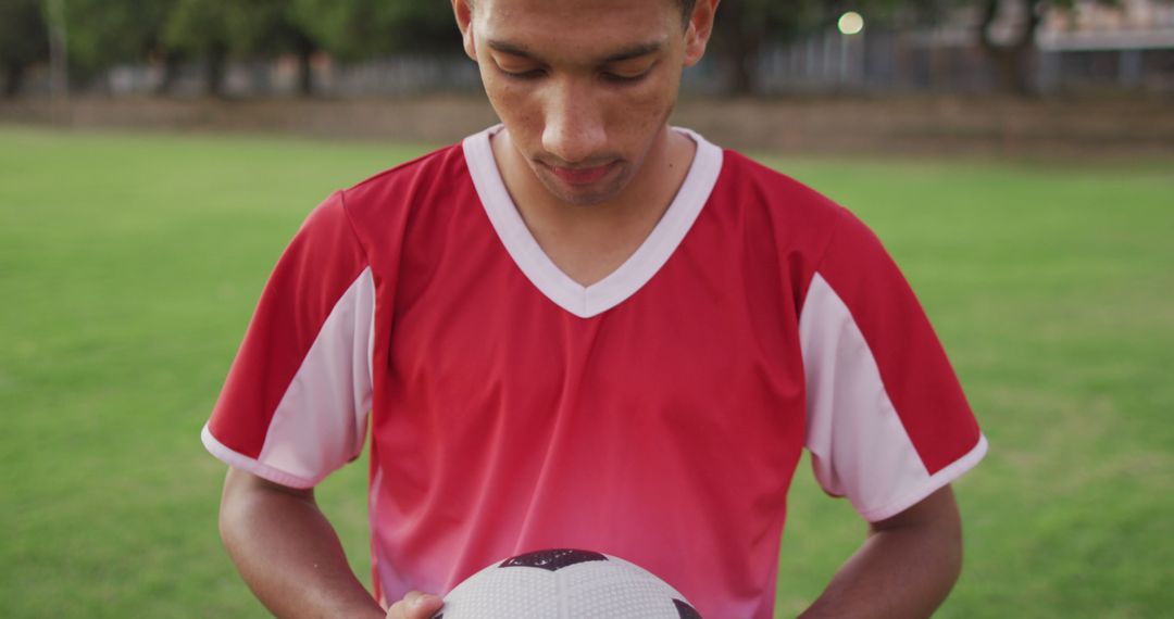 Male Soccer Player Holding Ball on Outdoor Field - Free Images, Stock Photos and Pictures on Pikwizard.com