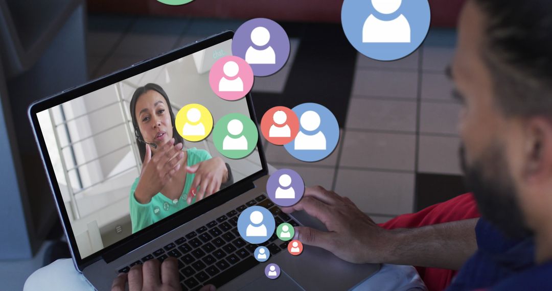 Diverse Man Attends Virtual Meeting with Floating Icons