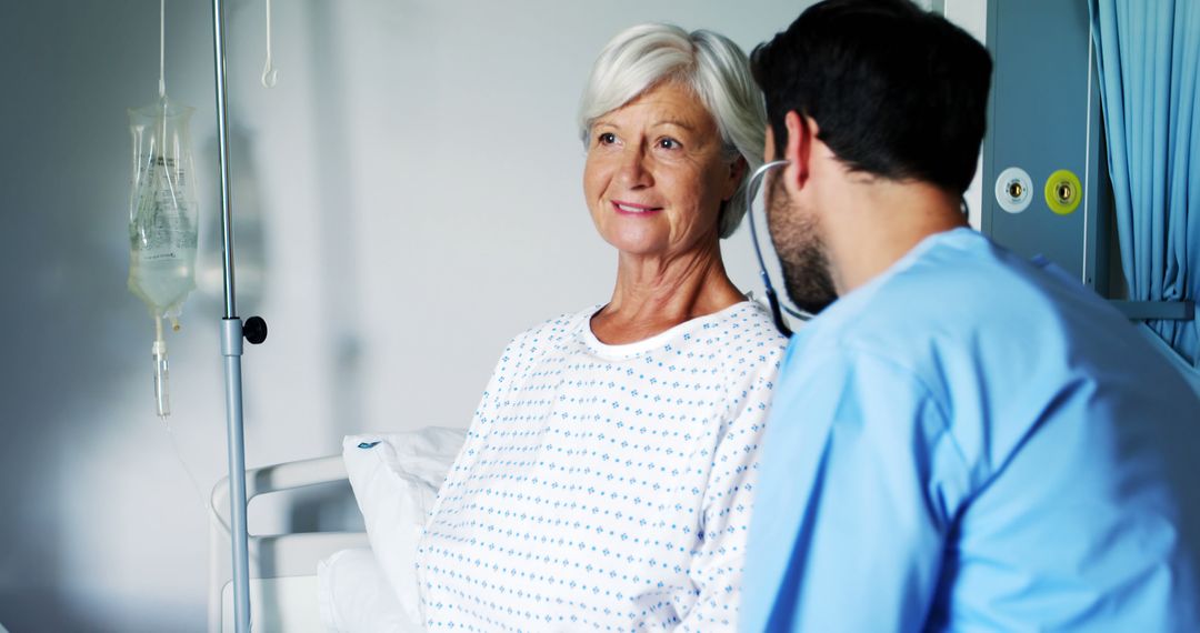 Elderly Patient Interacting with Doctor in Hospital Room - Free Images, Stock Photos and Pictures on Pikwizard.com