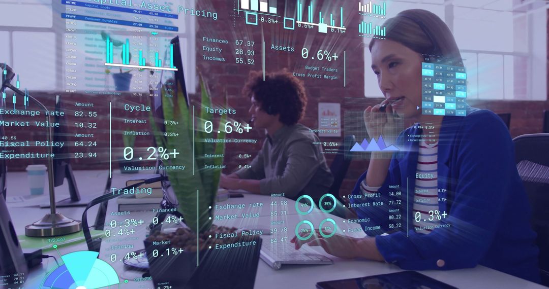 Diverse Professionals Analyzing Data with Digital Interfaces in Modern Office