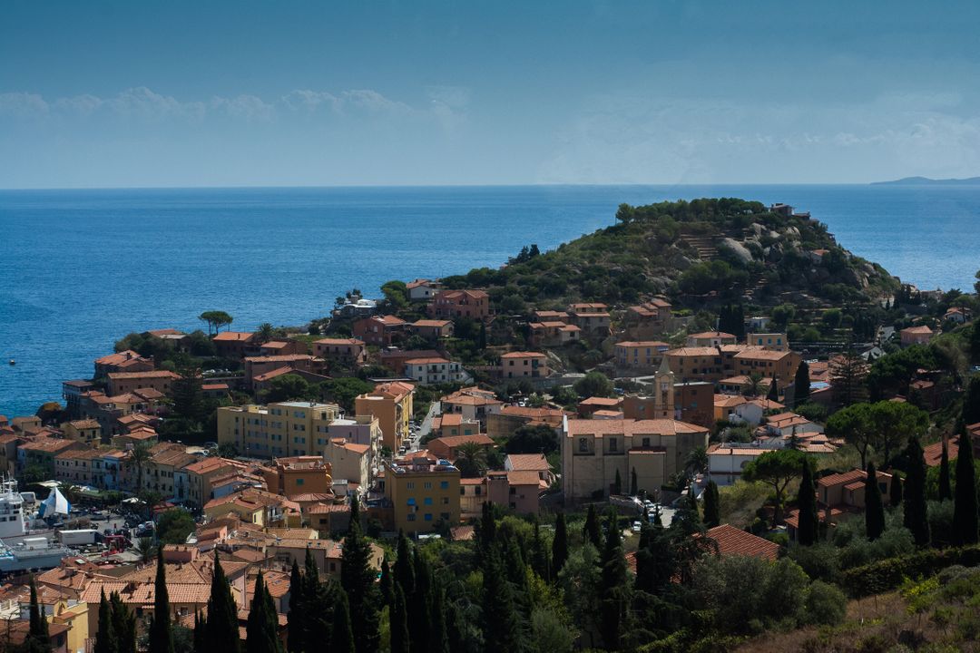 Coastal Mediterranean Town with Hillside Village Overlooking Sea - Free Images, Stock Photos and Pictures on Pikwizard.com