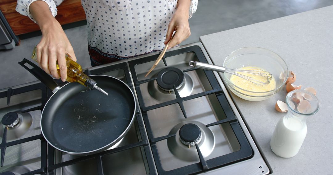 Woman Preparing Breakfast Omelette in Domestic Kitchen - Free Images, Stock Photos and Pictures on Pikwizard.com